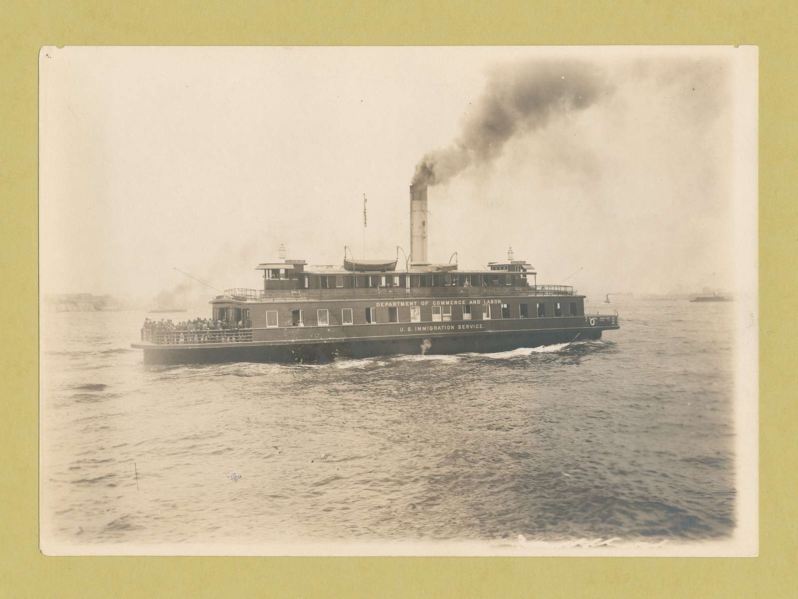 Ferry boat, the Ellis Island, which is also marked Department of Commerce and Labor, U.S ...